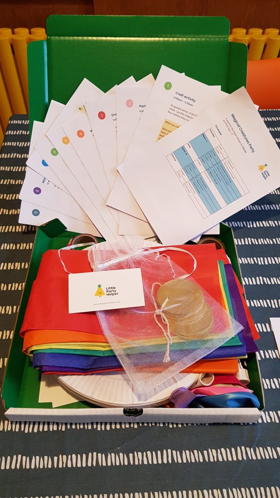 Party pack with guide materials, games props and craft materials in a box.